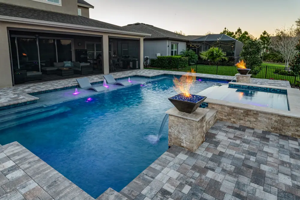 Dramatic evening lighting — Hawk Oasis custom pool project by Wahoo Pools in Tampa Bay, FL