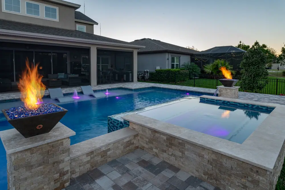 Pool at night — Hawk Oasis custom pool project by Wahoo Pools in Tampa Bay, FL