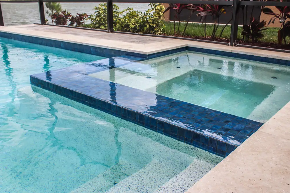 Flush spa detail — Lakeside Serenity custom pool project by Wahoo Pools in Tampa Bay lakefront