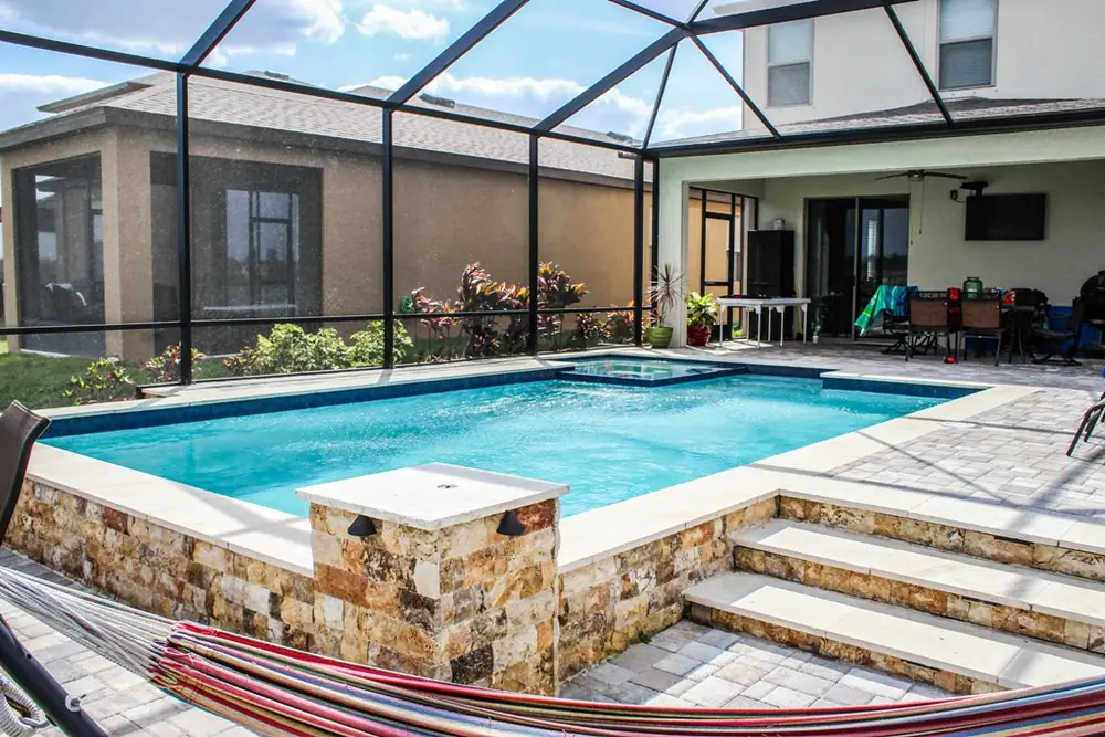 Pool and lake overview — Lakeside Serenity custom pool project by Wahoo Pools in Tampa Bay lakefront