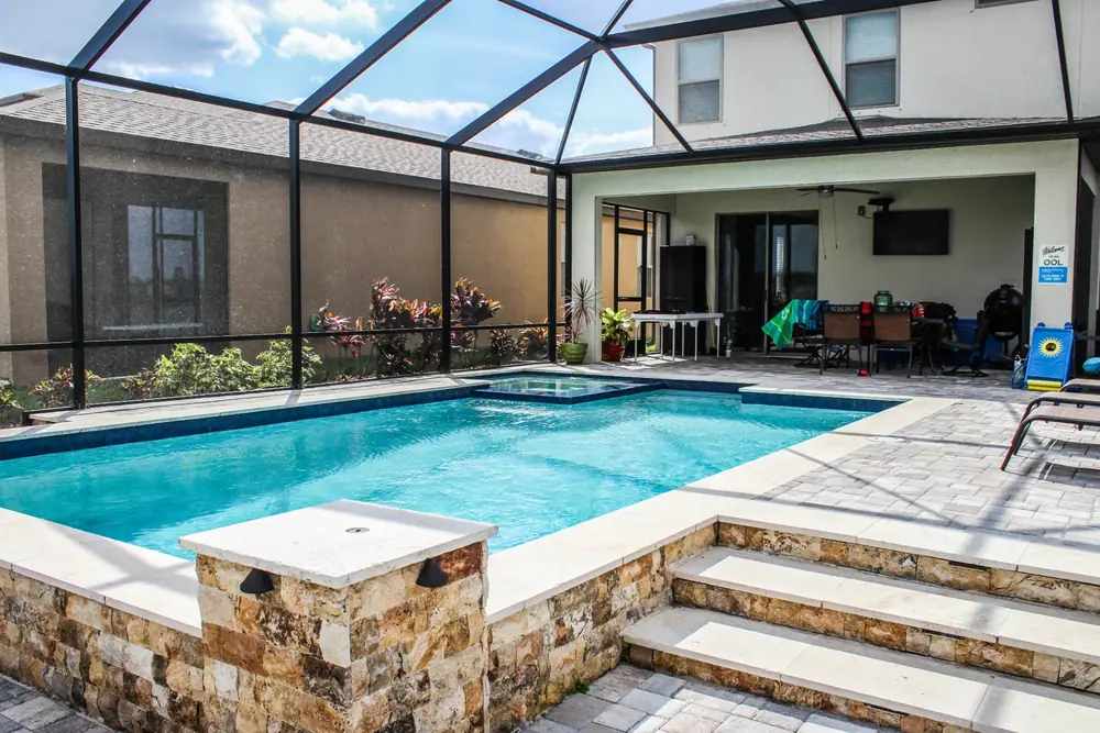 Arcing deck jets — Lakeside Serenity custom pool project by Wahoo Pools in Tampa Bay lakefront