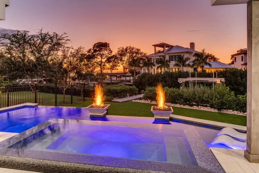 Pool and deck at sunset — Modern Sunset custom pool project by Wahoo Pools in Tampa, FL