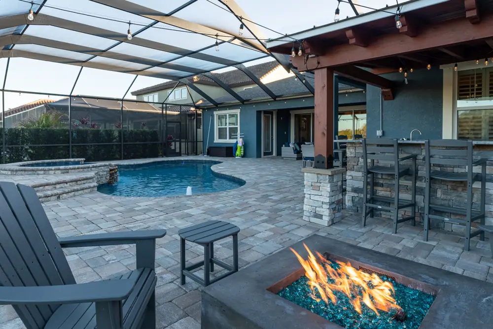 Poolside seating — Backyard Oasis custom pool project by Wahoo Pools in Tampa Bay, FL