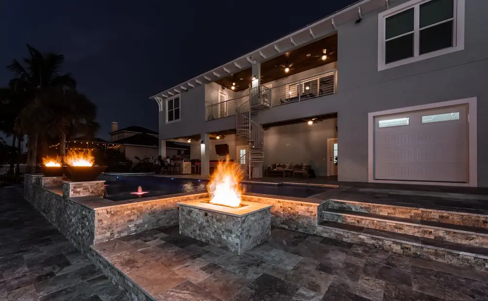 Pool at sunset — Reel Blessed Waterfront custom pool project by Wahoo Pools in Apollo Beach, FL