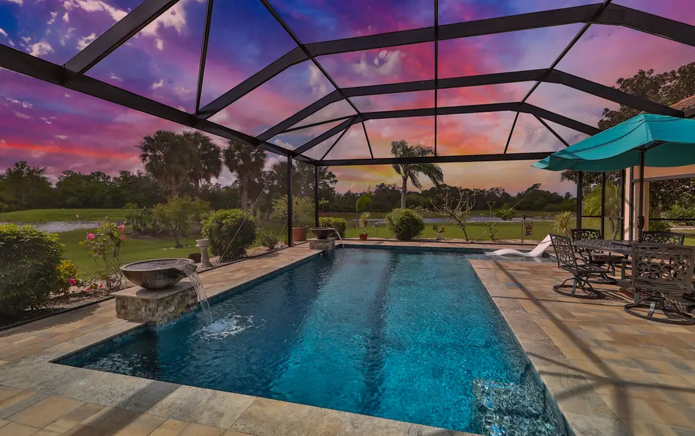 Contemporary pool at dusk — Signature 1101 custom pool project by Wahoo Pools in Tampa Bay, FL