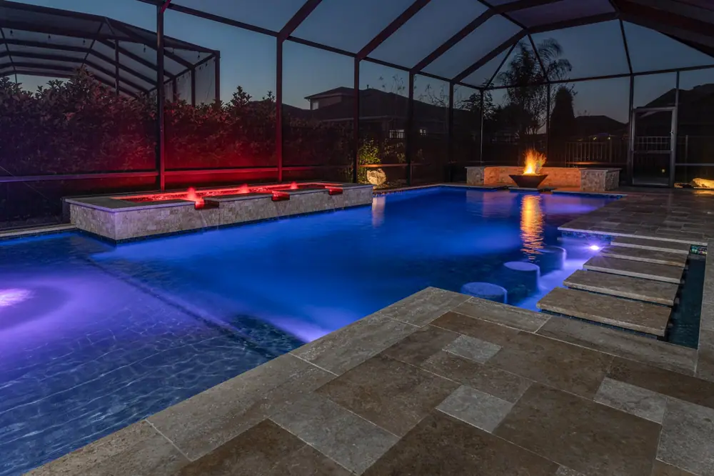 After dark pool water — Tequila Sunrise custom pool project by Wahoo Pools in Tampa Bay, FL