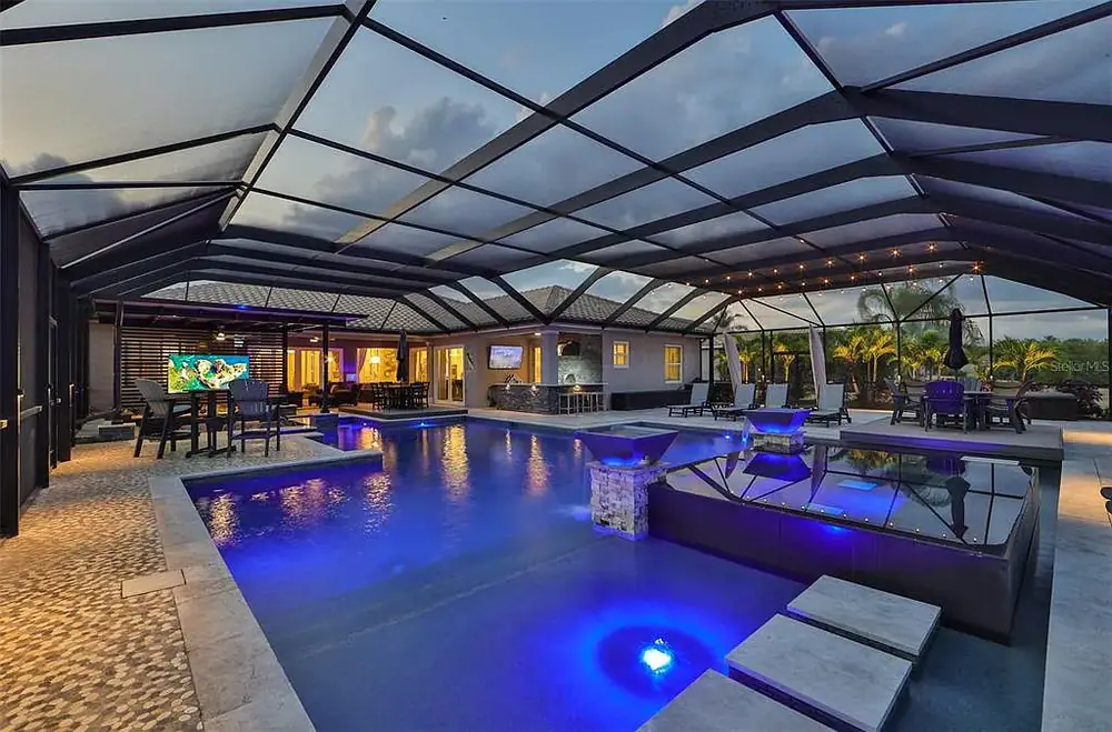 Travertine pool deck and spa — Timeless Project custom pool project by Wahoo Pools in Tampa, FL