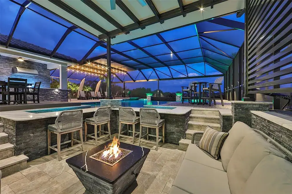 Evening view of classic pool — Timeless Project custom pool project by Wahoo Pools in Tampa, FL