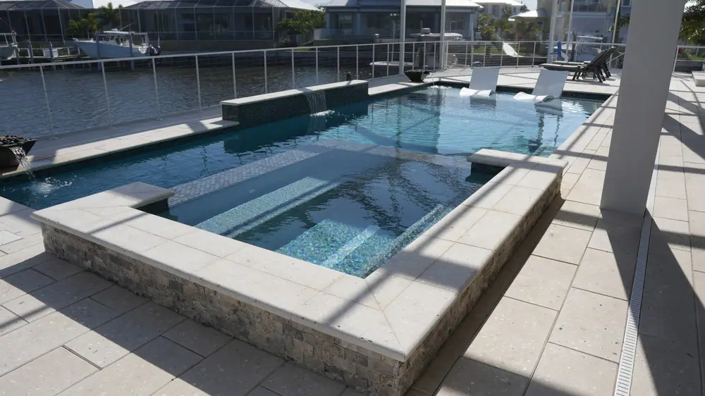 Canal-front pool overview — Vera Canal Retreat custom pool project by Wahoo Pools in Apollo Beach, FL