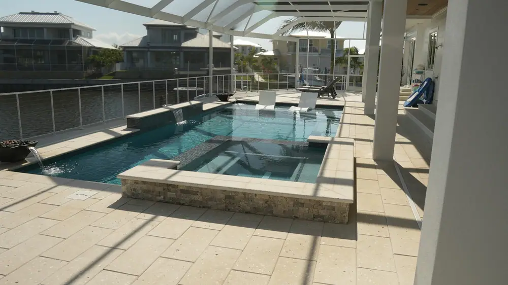 Evening lighting — Vera Canal Retreat custom pool project by Wahoo Pools in Apollo Beach, FL