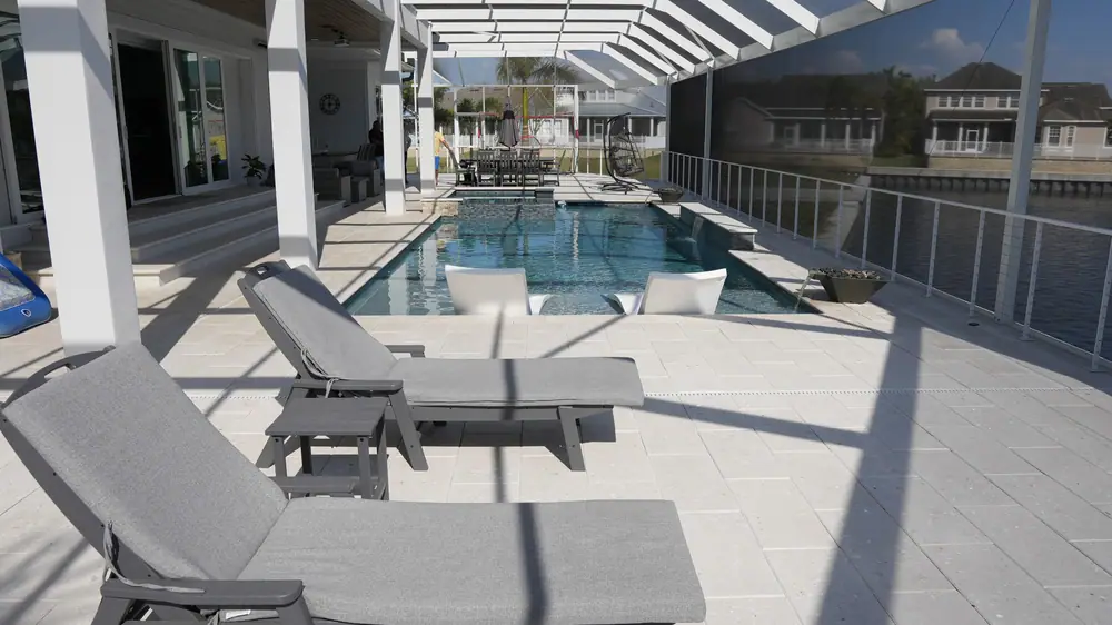 Sheer descent water wall — Vera Canal Retreat custom pool project by Wahoo Pools in Apollo Beach, FL